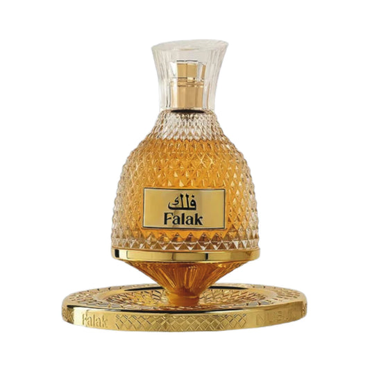 Falak de Nusuk, fragancia ambarada gourmand con azúcar moreno, caramelo, bizcocho, tófe, vainilla, ámbar, almizcle blanco y praliné. Golosa y envolvente.