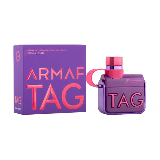 Tag Her Donna de Armaf, fragancia especiada y oriental con notas aromáticas y fondo dulce. Perfecta para mujeres seguras y con estilo sofisticado.